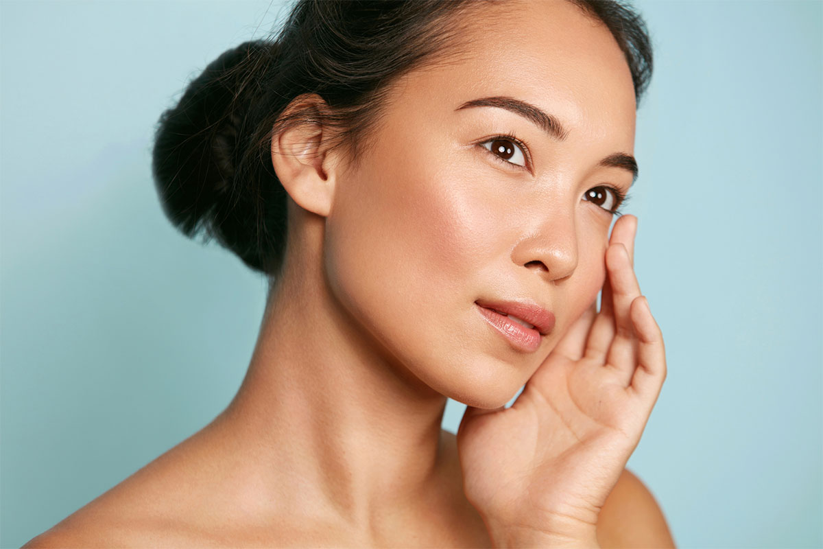 Woman at Paradise Dermatology preparing for Tetra CO2 laser treatment in Sarasota.